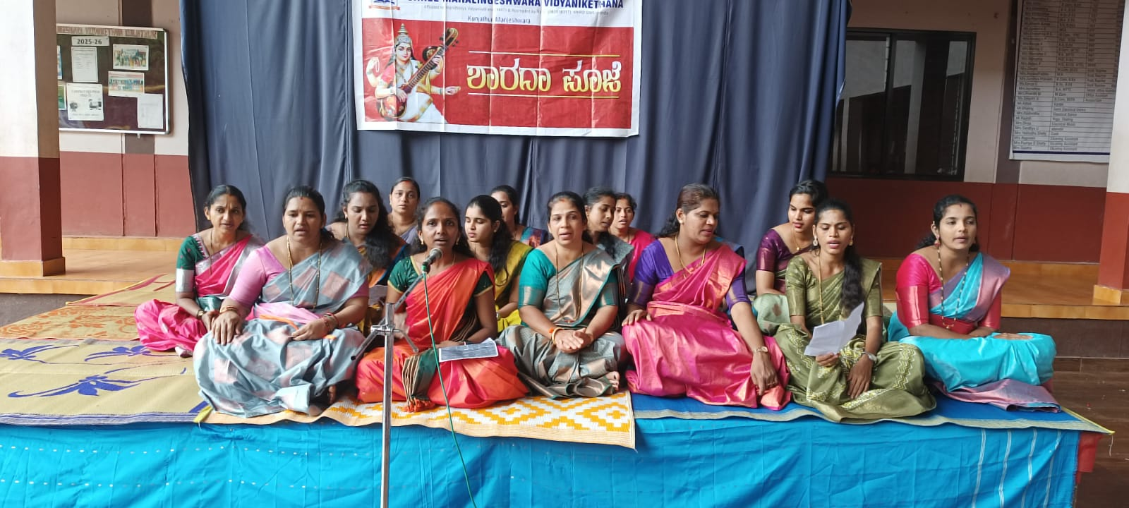 Staff group on stage during Onam celebration