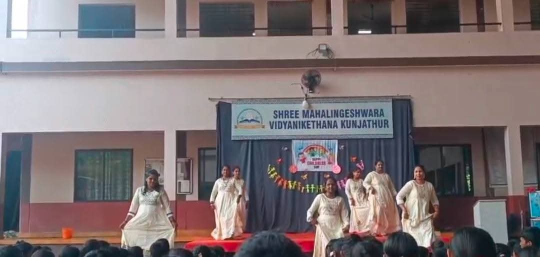 Teachers performing a dance on stage